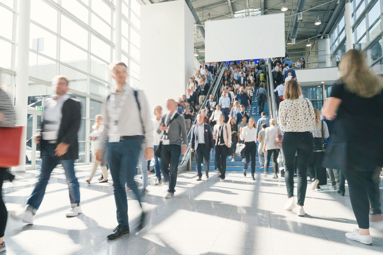 blurred business people at a trade fair